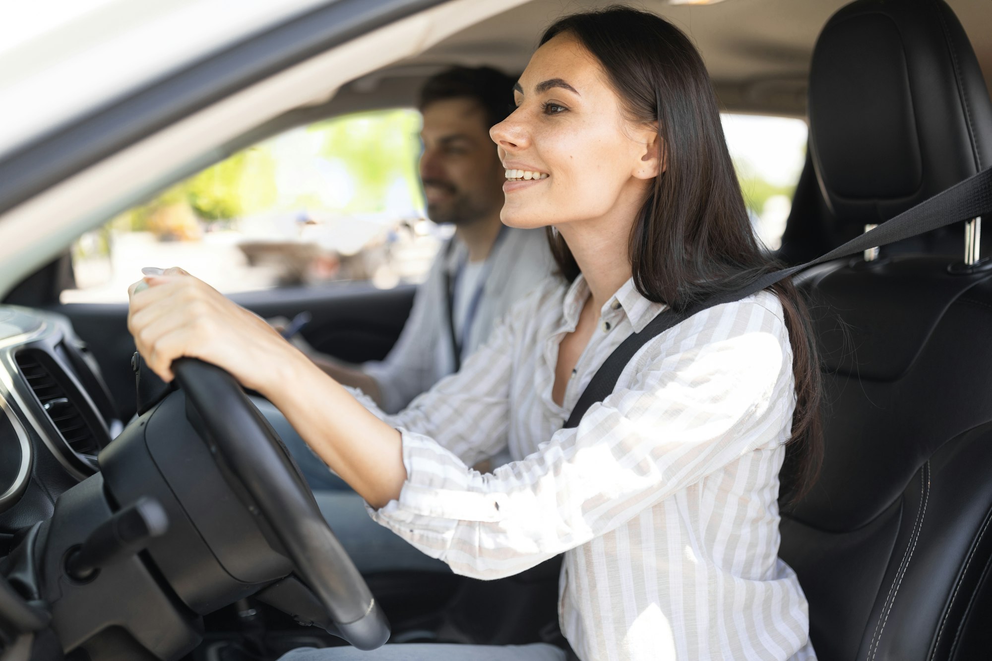 Lady student ready for new lesson with man driving instructor